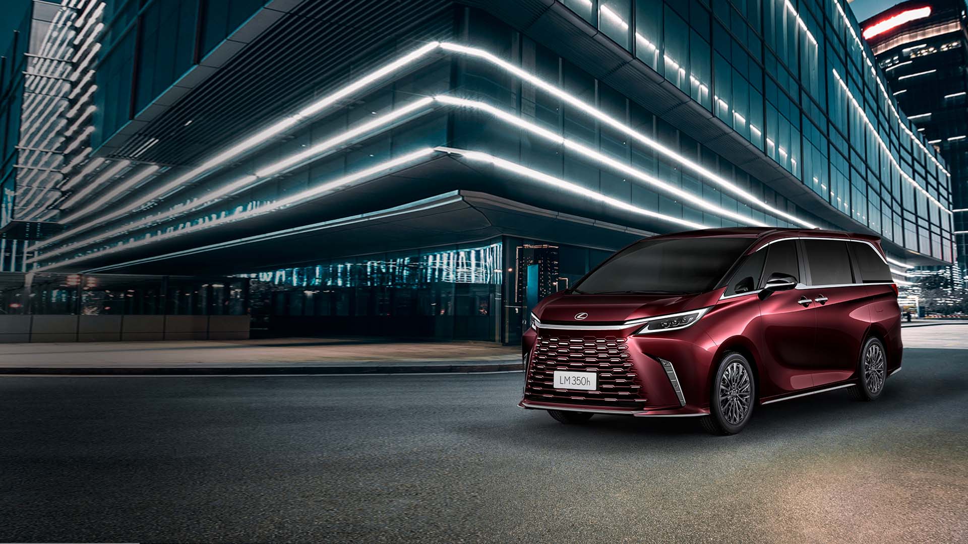 Lexus LM packed in front of a building